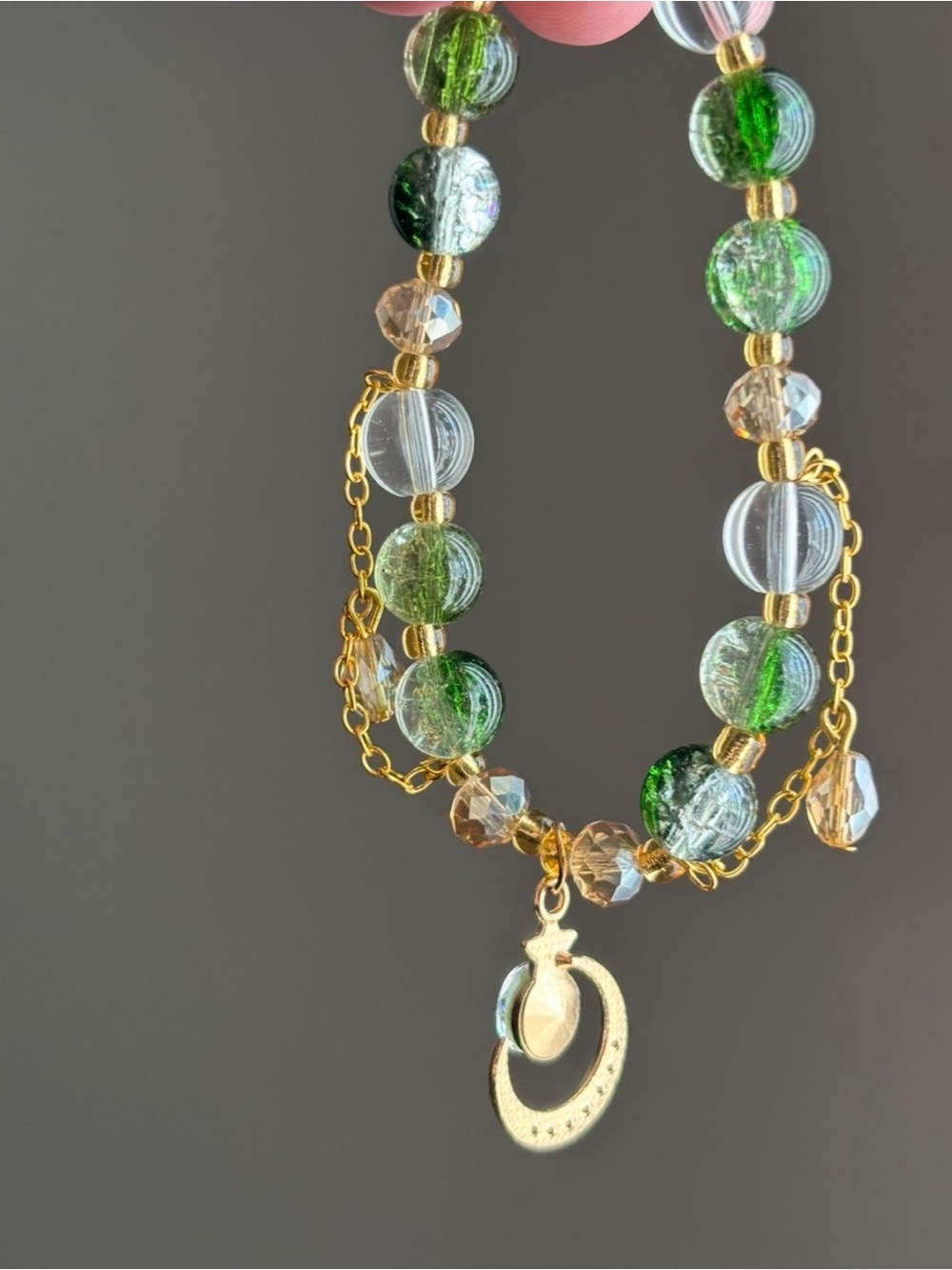 Hand Crafted Gold-tone Green and Clear Beaded Moon Pendant stretch bracelet - Picture 3 of 3